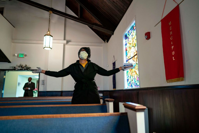 Congregants attend Sunday morning Easter services at The Friendship Baptist Church on April 12, 2020 in Baltimore, Maryland. 