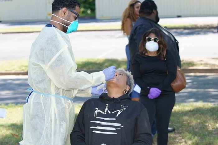 A woman gets a coronavirus test at Pastor Jamal Bryant's New Birth Missionary Baptist Church in Georgia on Sunday May 10, 2020.