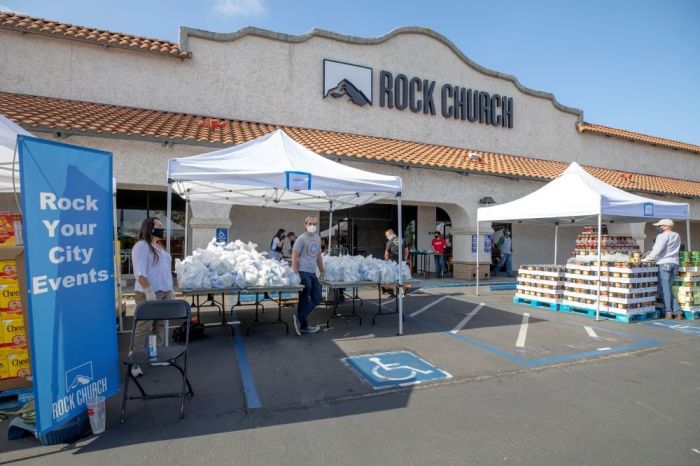 Volunteers serve at a food distribution event hosted by Rock Church in Southern California on May 16, 2020. 