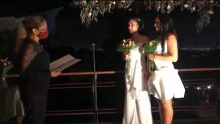 Daritza Araya Arguedas and Alexandra Quirós Castillo participate in their wedding ceremony in San Isidro de Heredia on May 26, 2020.