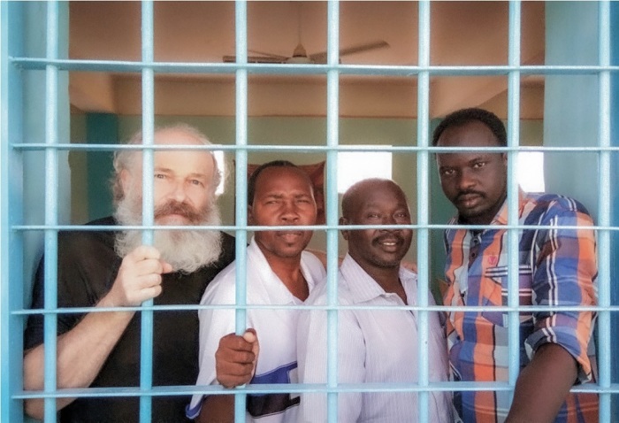 Czech Voice of the Martyrs missionary Petr Jasek (L) poses for a photo with Sudanese pastors inside of a prison in Sudan during his 14-month imprisonment from December 2015 to February 2017. 