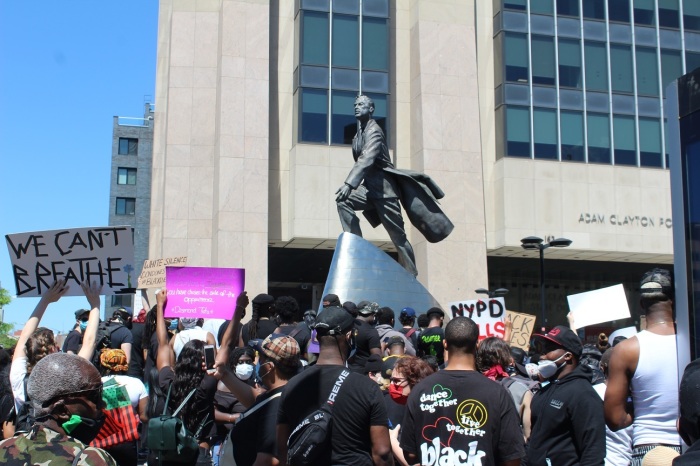People protest the killing of George Floyd at the Adam Clayton Powell Jr. State Office Building in Harlem, New York on Saturday May 30, 2020.