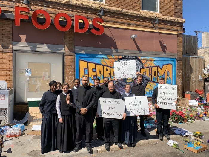 Members of The Church of God located in Greenville, Ohio, protest in front of the Cup Foods store in Minneapolis, Minn., where George Floyd was killed.