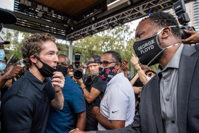 Pastor Joel Osteen greets Lee Meritt, a lawyer for George Floyd's family at a march in honor of George Floyd on June 2, 2020, in Houston, Texas. Members of George Floyd's family participated in a march that went from Discovery Green to City Hall with support from the local chapter of Black Lives Matter. 