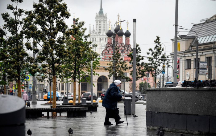 An elderly woman wearing a mask walks in central Moscow, on June 2, 2020, amid the outbreak of COVID-19, caused by the novel coronavirus.