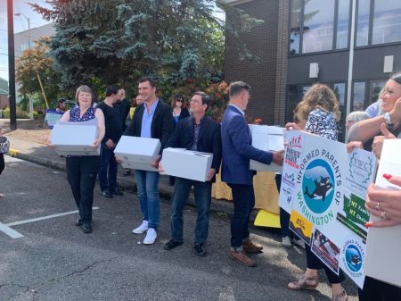 Members of Informed Parents of Washington drop off signatures petitioning for a referendum against recent sex-ed legislation in Olympia, Washington earlier this year.
