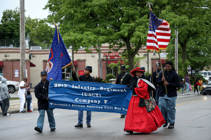 Members of the parade perform during the 48th Annual Juneteenth Day Festival on June 19, 2019, in Milwaukee, Wisconsin. 