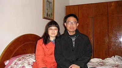 Liu Xianbin (right) with his wife, Chen Mingxian, at home on June 27, 2020. 