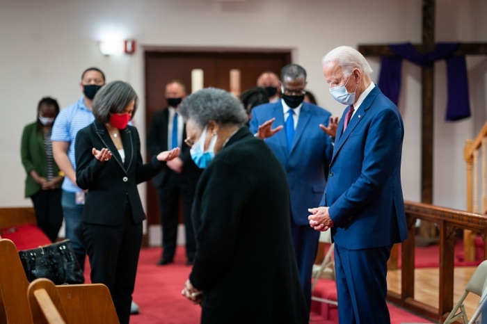 Former vice president and presumptive Democratic presidential nominee Joe Biden (R) prays with community leaders at Bethel AME in Wilmington, Delaware, on June 1, 2020.