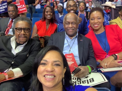 Herman Cain (C) poses with Black Voices for Trump members at a rally for President Donald Trump in Tulsa, Okl. on June 20, 2020.