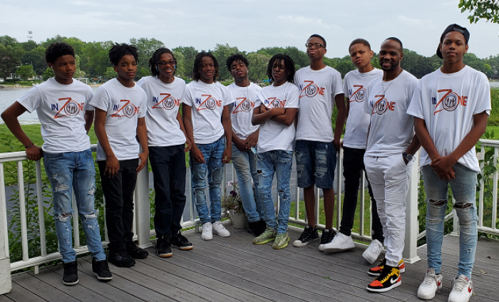 Terrance Wallace, the founder of The InZone Project, poses with the young men housed through the program. Youth from underserved communities have been relocated to receive better opportunities and discipleship. 