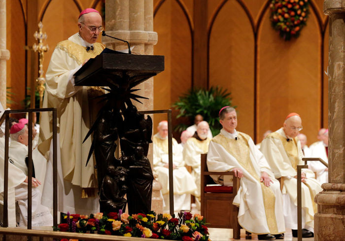 Archbishop Carlo Maria Viganò, Apostolic Nuncio of the United States, reads the Apostolic Mandate during the Installation Mass of Archbishop Blase Cupich at Holy Name Cathedral, November 18, 2014 in Chicago. 