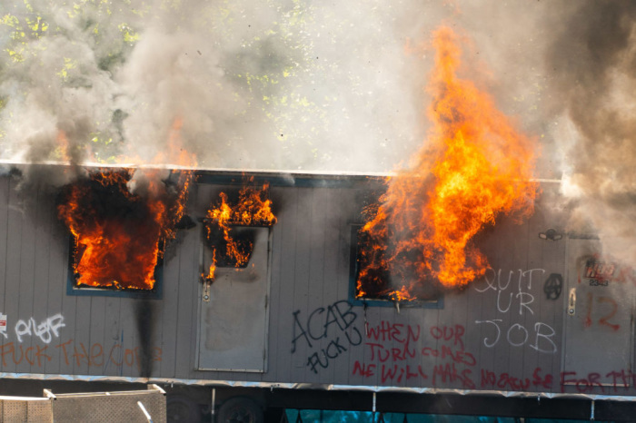 A trailer on a construction site for a youth detention center burns after protesters targeted the site during protests in Seattle on July 25, 2020, in Seattle, Washington.