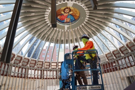 Workers install a skylight at St. Nicholas Greek Orthodox Church and National Shrine in New York City on Aug. 3, 2020.
