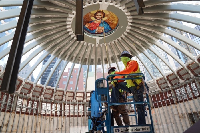 Workers install a skylight at St. Nicholas Greek Orthodox Church and National Shrine in New York City on Aug. 3, 2020. 