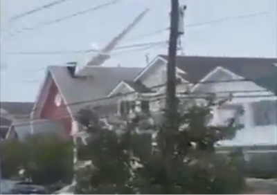 Tropical Storm Isaias rips a steeple off of the front of the Central Ocean City Union Chapel in Ocean City, New Jersey, on Aug. 4, 2020. 