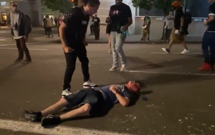 A man lays unconscious on a street in Portland, Oregon after being kicked in the head by a protester on Aug. 16, 2020. 