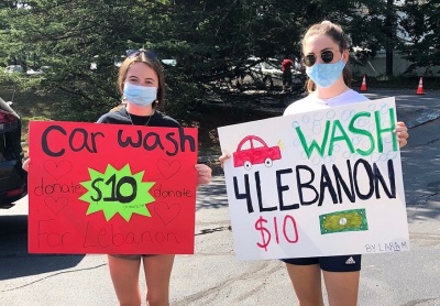 Members of St. George Orthodox Church of Boston, Massachusetts, hold a car wash on Aug. 22, 2020, to benefit the victims of the explosion in Beirut, Lebanon. 