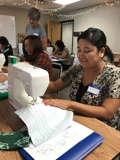 Burmese Christian refugees learning in sewing class at South Tulsa Baptist Church in Tulsa, Oklahoma. 