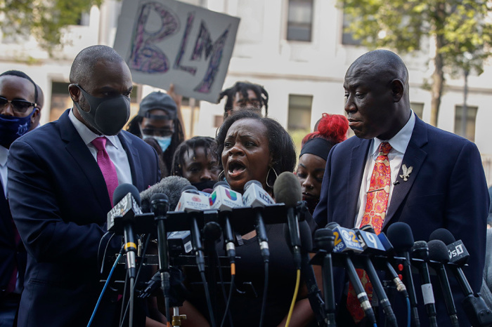 Julia Jackson (C), mother of Jacob Blake Jr., speaks next to National Civil Rights Attorney Ben Crump (R) during a press conference outside of the County Courthouse in Kenosha, Wisconsin on August 25, 2020.
