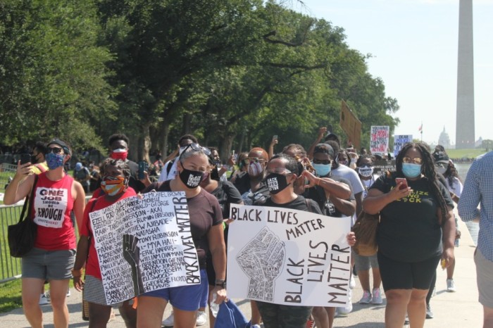 Demonstrators participate in the Get Your Knee Off Our Necks Commitment March in Washington D.C. on Aug. 28. 2020.