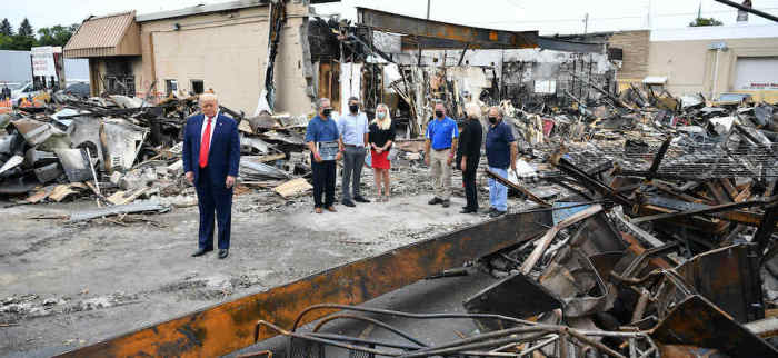 US President Donald Trump tours an area affected by civil unrest in Kenosha, Wisconsin on September 1, 2020. Trump said Tuesday on a visit to protest-hit Kenosha, Wisconsin that recent anti-police demonstrations in the city were acts of 'domestic terror' committed by violent mobs. 