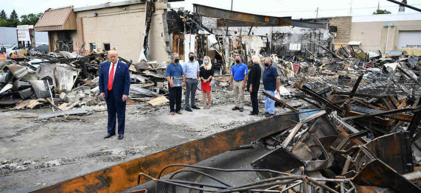 US President Donald Trump tours an area affected by civil unrest in Kenosha, Wisconsin on September 1, 2020. Trump said Tuesday on a visit to protest-hit Kenosha, Wisconsin that recent anti-police demonstrations in the city were acts of "domestic terror" committed by violent mobs.