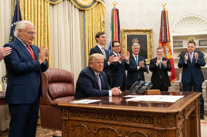 President Donald J. Trump, joined by White House senior staff members, delivers a statement announcing the agreement of full normalization of relations between Israel and the United Arab Emirates Thursday, Aug. 13, 2020, in the Oval Office of the White House. 