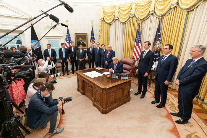 President Donald J. Trump, joined by White House senior staff members, delivers a statement announcing the agreement of full normalization of relations between Israel and the United Arab Emirates Thursday, Aug. 13, 2020, in the Oval Office of the White House. 
