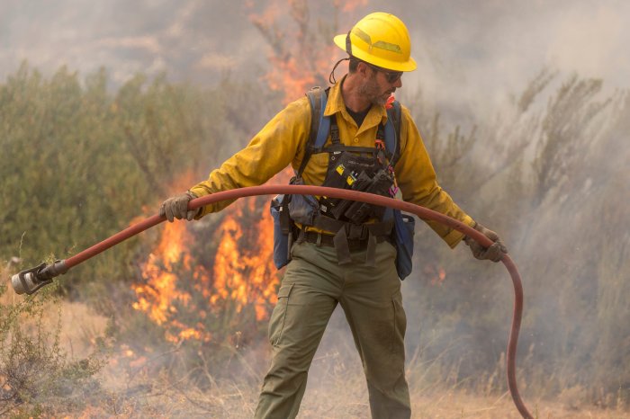 A member of the U.S. Forest Service works to contain wildfires in Oregon.