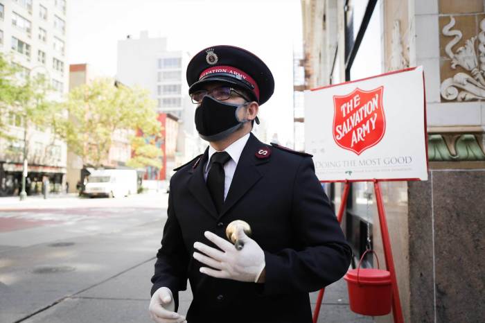 A Salvation Army bell ringer amid the COVID-19 pandemic.