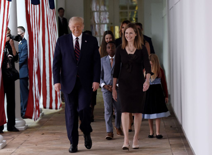 US President Donald Trump and Judge Amy Coney Barrett walk to the Rose Garden of the White House in Washington, D.C., on September 26, 2020. Trump nominated Barrett to the U.S. Supreme Court. 