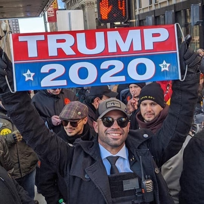 South Florida resident Enrique Tarrio, who is the international chairman of the controversial far-right Proud Boys group, holds a sign in support of President Donald Trump.