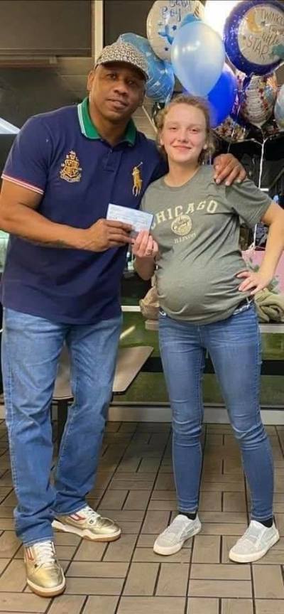 Bishop Eusebio Phelps, pastor of New Faith Christian Church in Stockbridge, Ga., pictured with Hannah Hill, the Waffle House waitress he raised over ,000 in donations for. 