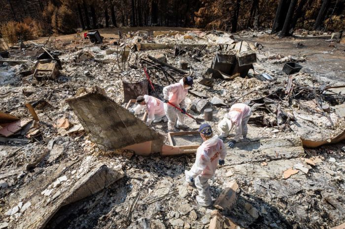 Samaritan's Purse volunteers sift through the remains of the home of Dan and Rochelle Kelly in Boulder Creek, California, in September 2020. The home was among thousands destroyed in the 2020 wildfire season.