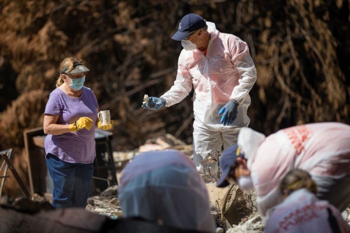 Samaritan's Purse volunteers sift through the remains of the home of Dan and Rochelle Kelly (L) in Boulder Creek, California, attempting to find salvageable items in September 2020. The home was among thousands destroyed during the 2020 wildfire season.