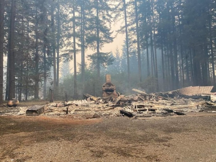 A chimney and fireplace are the only things standing at the site of the burned-down Dodge Community Church near Estacada, Oregon, which was destroyed by the Riverside Fire in September 2020. 