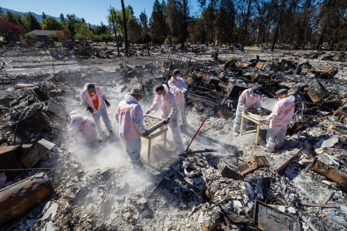 Samaritan's Purse volunteers sift through a burned-down home in Jackson County, Oregon, in the wake of a wildfire in September 2020. 