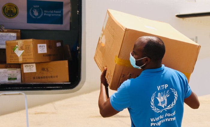 World Food Program staff distribute food during the coronavirus pandemic.