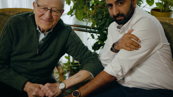 In a display of solidarity, holocaust survivor, Irving Roth, and Muslim turned pro-Israel activitst, Kasim Hafeez, show their matching tattoos in NEVER AGAIN?, in theaters nationwide for two nights only October 13 & 14. 