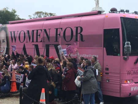 Members of Concerned Women for America chapters pose in front of the "Women for Amy" tour bus in Washington D.C. on Oct. 12, 2020.