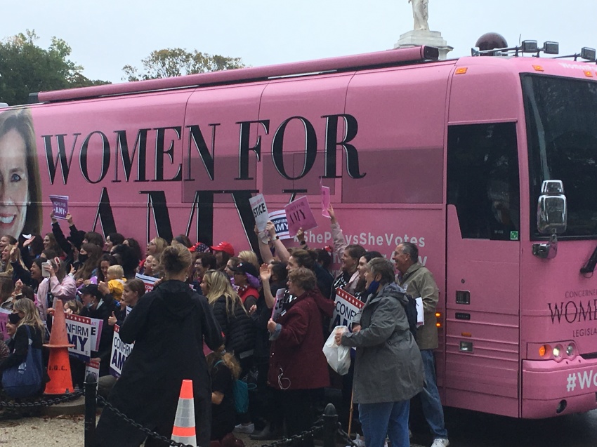 Members of Concerned Women for America chapters pose in front of the "Women for Amy" tour bus in Washington D.C. on Oct. 12, 2020.