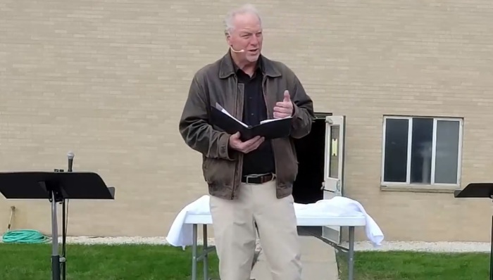 Pastor Keith Mannes, formerly of of East Saugatuck Church of Holland, Michigan, preaches his final sermon at an outdoor service on Sunday, Oct. 11, 2020. 