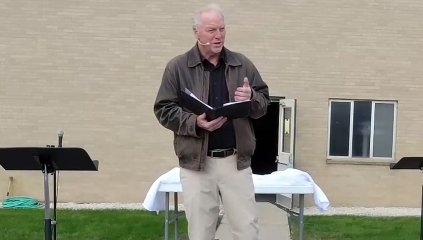 Pastor Keith Mannes, formerly of of East Saugatuck Church of Holland, Michigan, preaches his final sermon at an outdoor service on Sunday, Oct. 11, 2020.