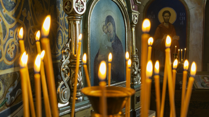  Candles burn in an orthodox church.