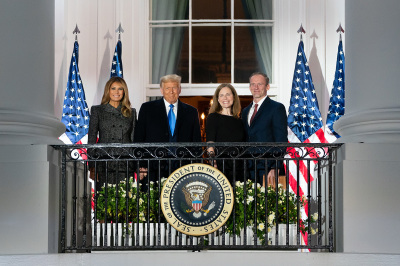 President Donald J. Trump, First Lady Melania Trump, Supreme Court Associate Justice Amy Coney Barrett, and her husband Jesse Barrett greet invited guests on the Blue Room Balcony of the White House Monday, Oct. 26, 2020, after attending Barrett’s swearing-in ceremony as Supreme Court Associate Justice. 