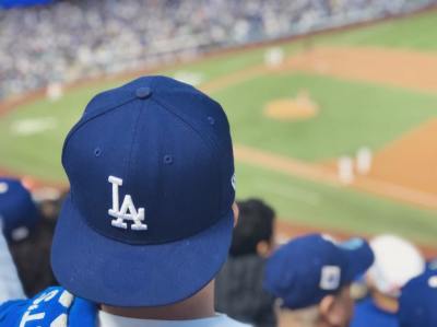 A Dodgers fan watches a game at Dodger Stadium in Los Angeles.