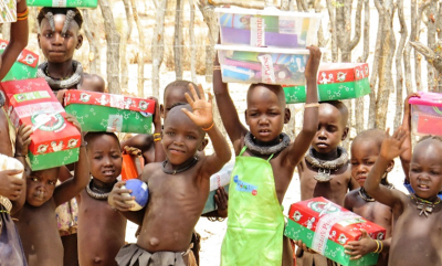 Himba children receiving their Operation Christmas Child shoebox gifts