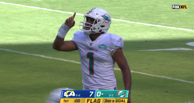 Miami Dolphins quarterback Tua Tagovailoa points up during a game against the Los Angeles Rams, Nov. 1, 2020.