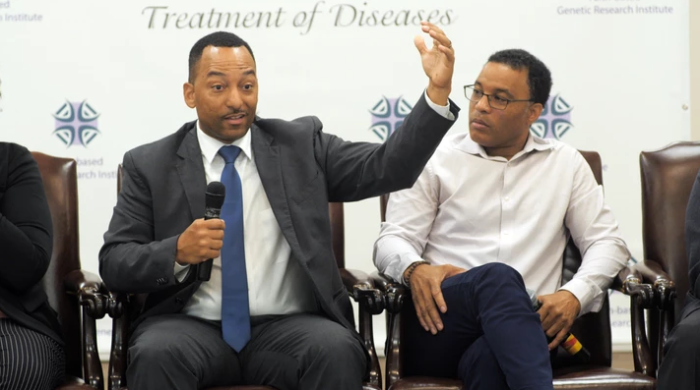 Tshaka Cunningham (L), is executive director of The Faith Based Genetic Research Institute, and co-founder and chief scientific officer of TruGenomix, 